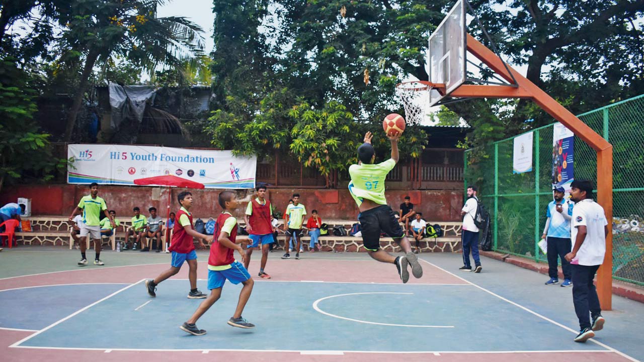 A cager takes a shot during a basketball match in the tournament 
