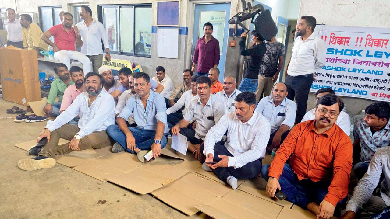 Bus owners stage a protest at the company`s showroom in Naigaon