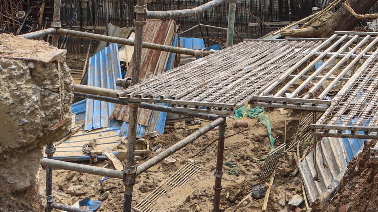 Rescue work underway after a wall at a construction site collapsed amid rain on Friday. Pics/PTI