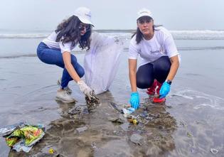 Bollywood actress Neha Dhupia and Mithila Palkar joined hands to clean Juhu Beach after Ganpati Visarjan. Pic/PTI
