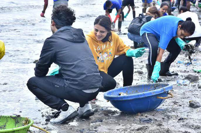Radhika Madan was seen removing garbage from the beach. The actress didn’t shy away from getting her hands dirty. Pic/Facebook
