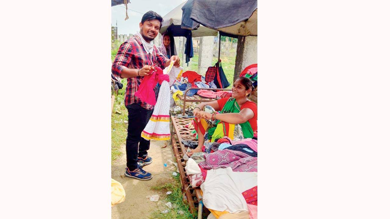 Vinod Nindrojiya inspects clothes with a Waghri community recycler 