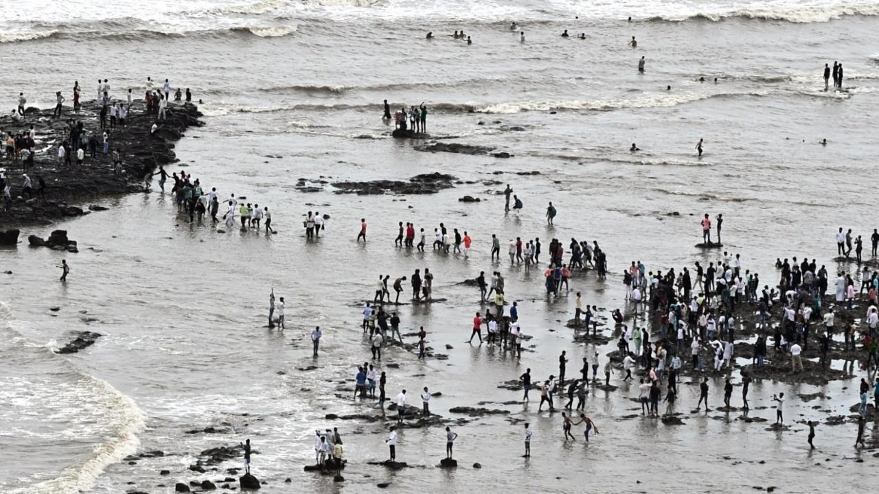 The narrow path leading up to the Haji Ali Dargah, which was built in the 13th Century, was crowded by devouts visiting the shrine to offer their prayers.