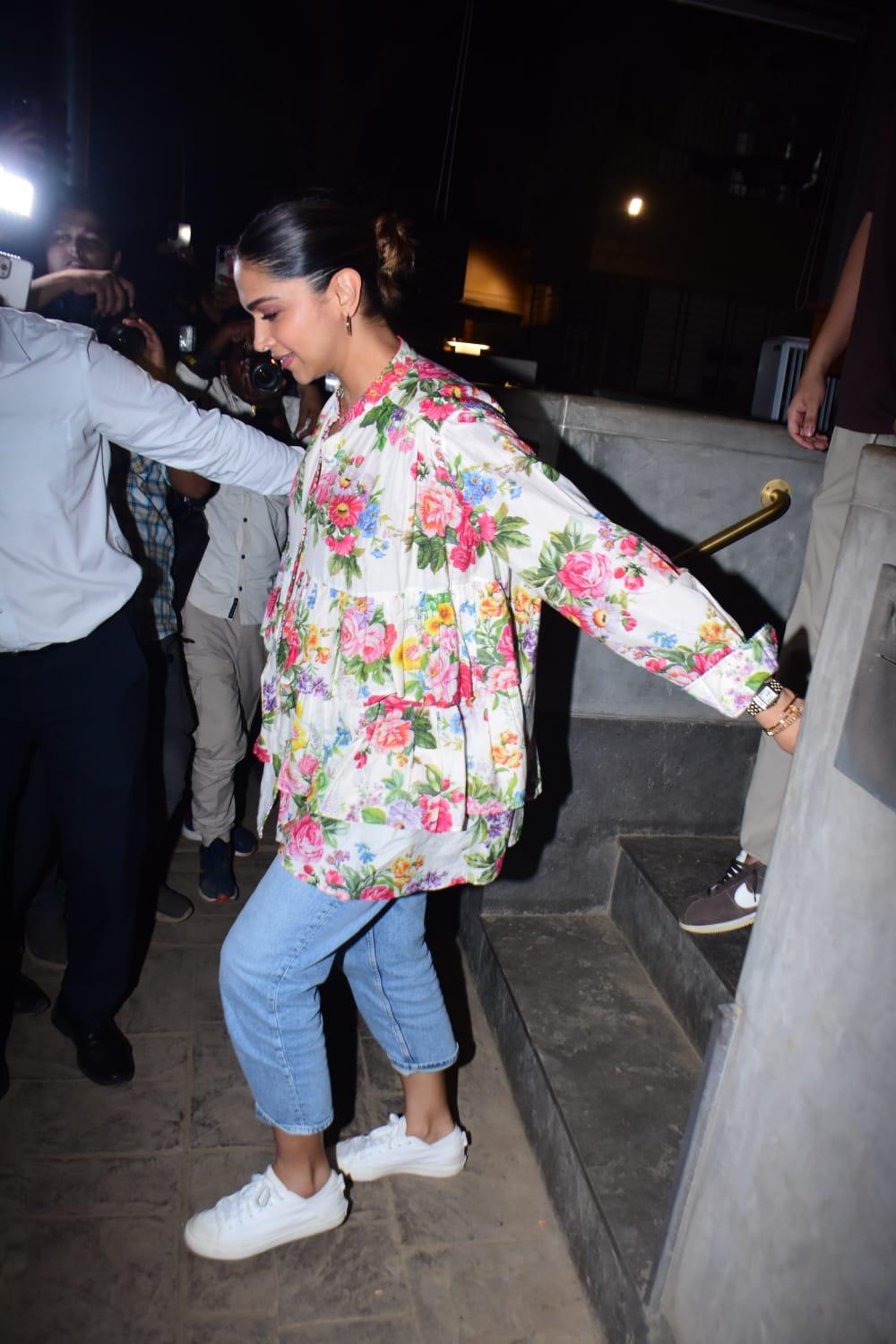 Mom-to-be Deepika Padukone flaunt her baby bump in a floral top and paired it with blue jeans