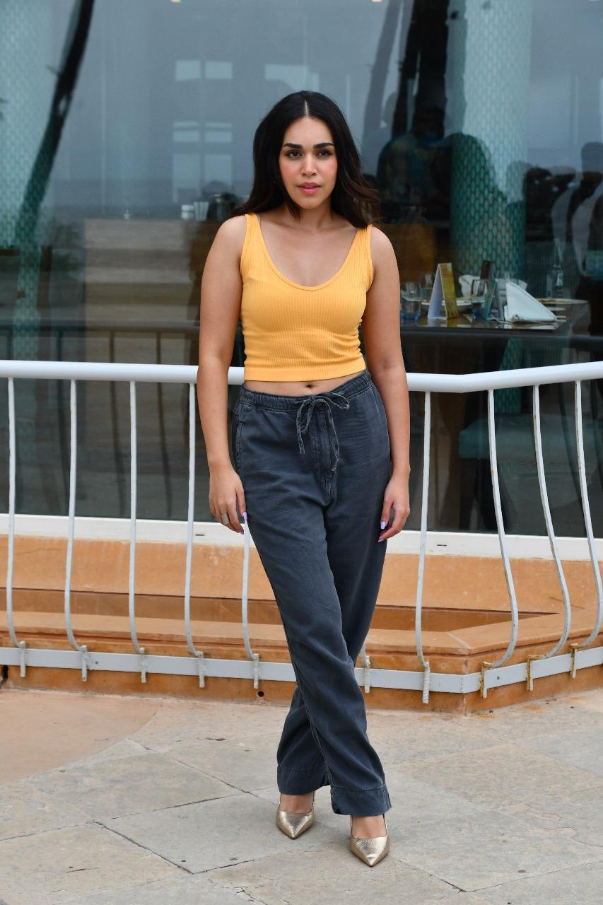 Naila Grrewal wore a yellow tank top and paired it with blue jeans as she went out to promote her upcoming film Ishq Vishq rebound
