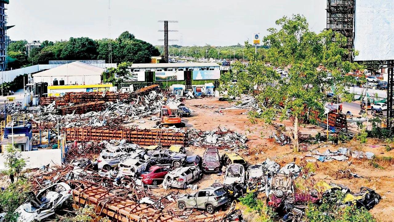 Vehicles that were crushed under the billboard. File pic/Rajesh Gupta