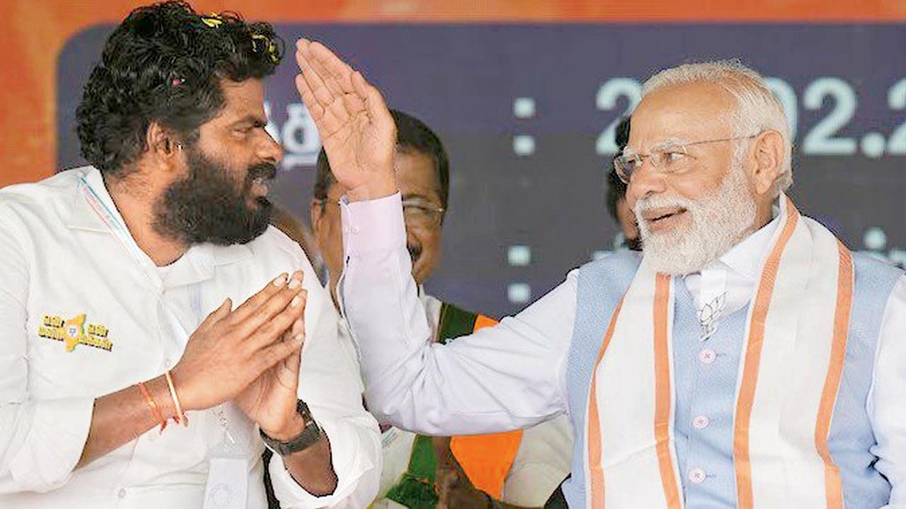PM Modi with K Annamalai while campaigning.