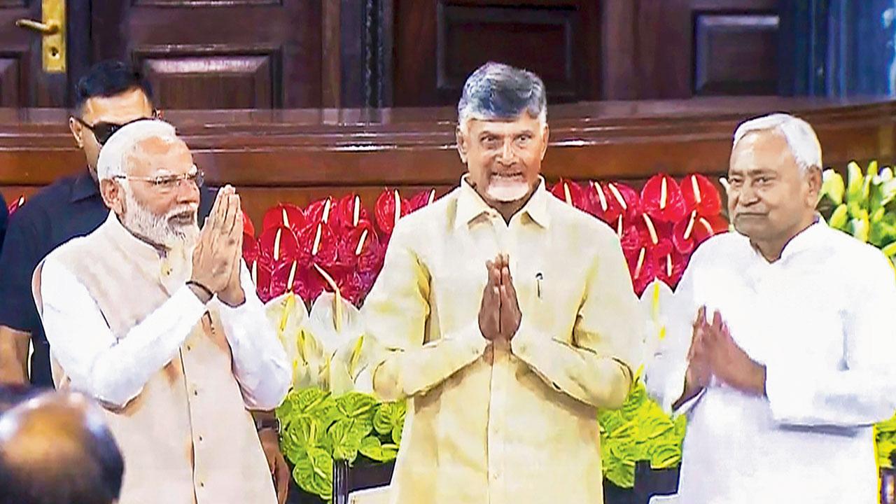 PM designate Narendra Modi with TDP chief N Chandrababu Naidu and JD(U) leader Nitish Kumar. PIC/PTI