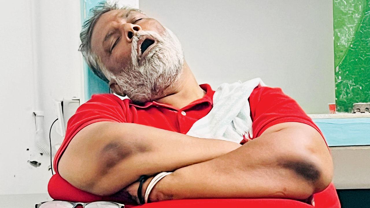 A tired Pappu Yadav catches up on sleep during campaigning in Purnea. Pic/Mayank Shekhar