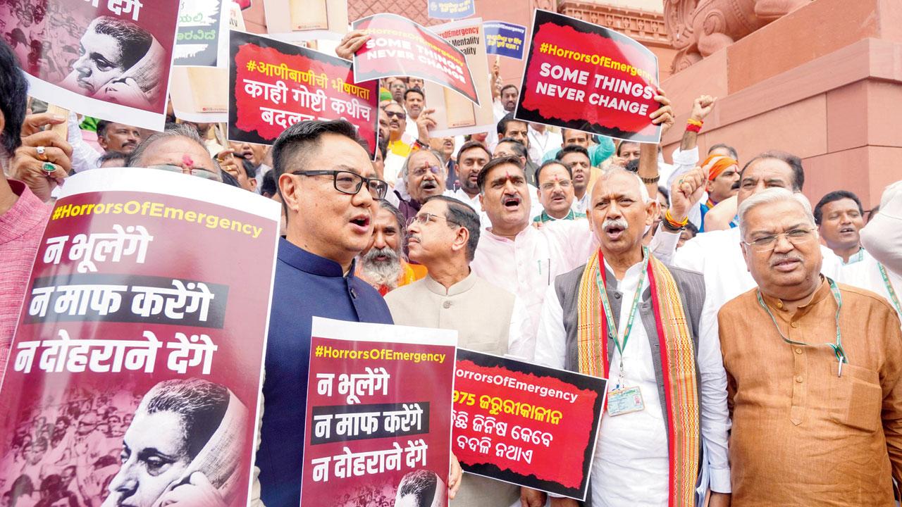 BJP members stage a protest to mark the anniversary of the “Emergency” at the Parliament House complex. Pic/PTI