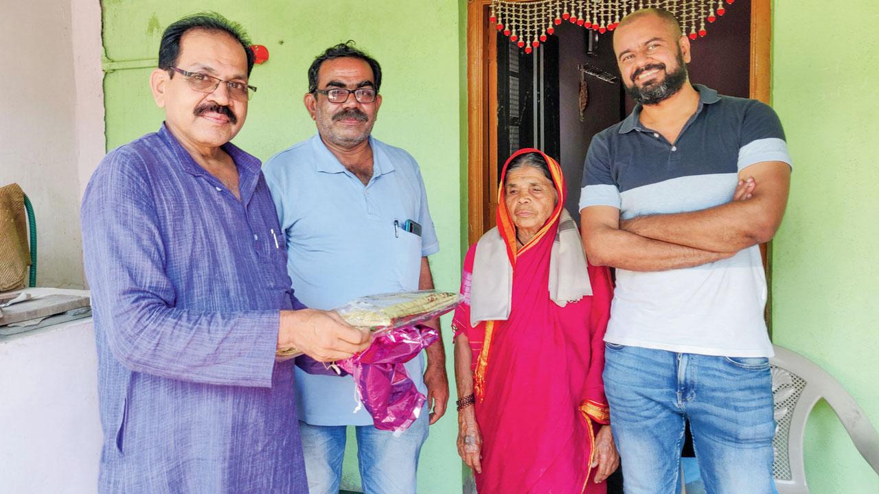 Shahu Patole with his brother and mother and translator Bhushan Korgaonkar at the former’s home in Khamgaon, Osmanabad