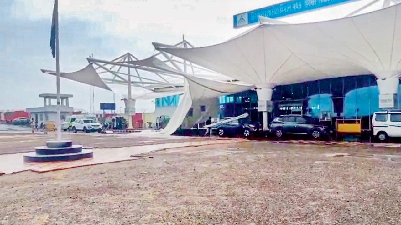 A portion of the  collapsed canopy at Rajkot airport. Pic/PTI