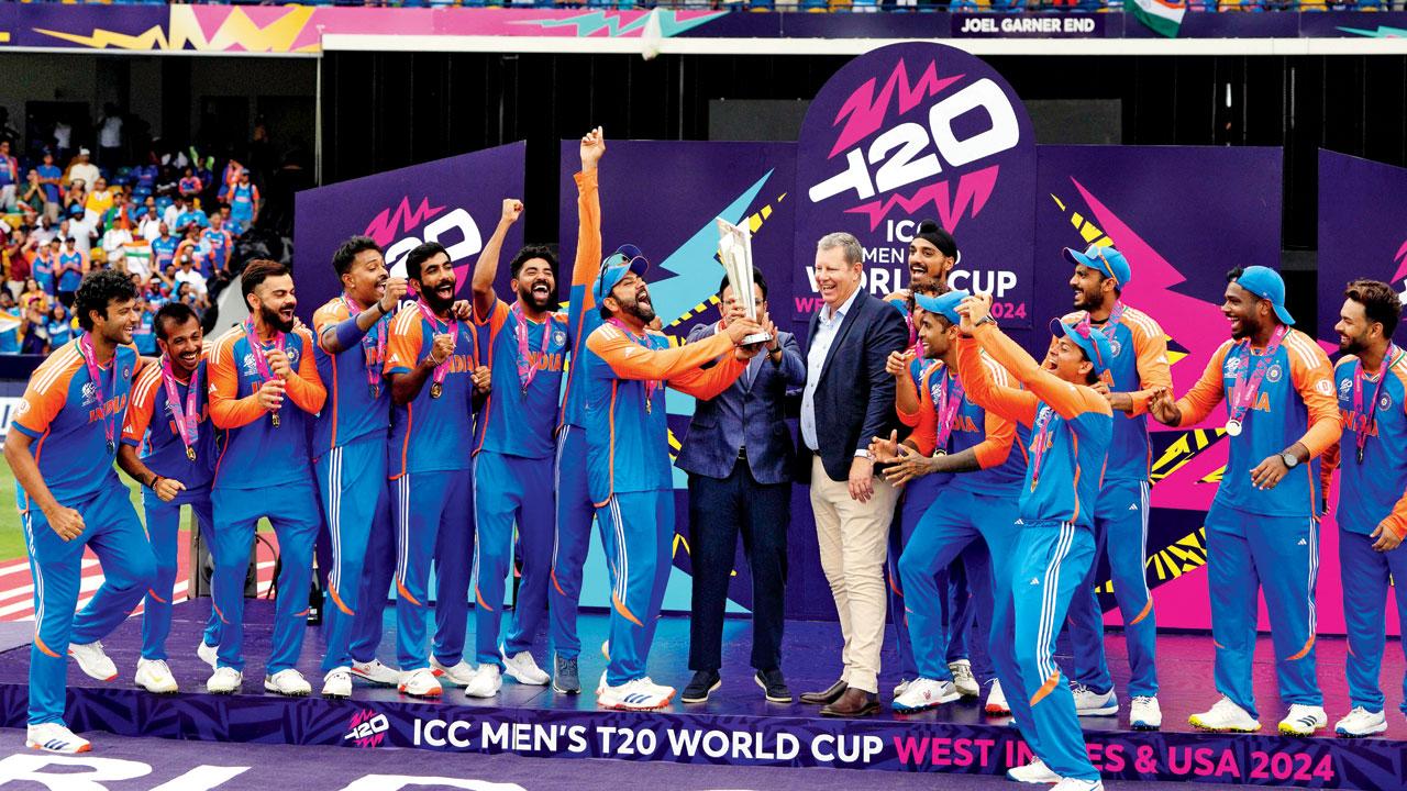 India captain Rohit Sharma is ecstatic after receiving the T20 World Cup trophy in Barbados on  Saturday. Pic/Getty Images