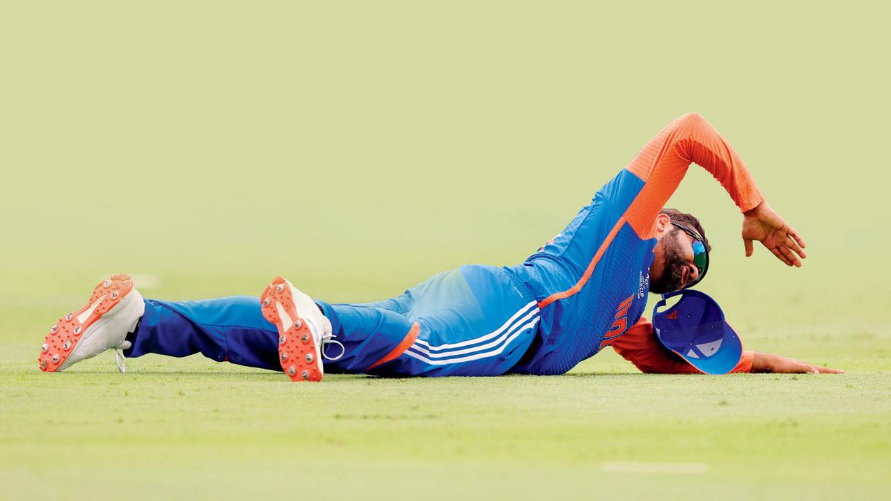Rohit Sharma falls to the ground in celebration moments after India beat South Afrca to win the T20 World Cup. Pic/PTI