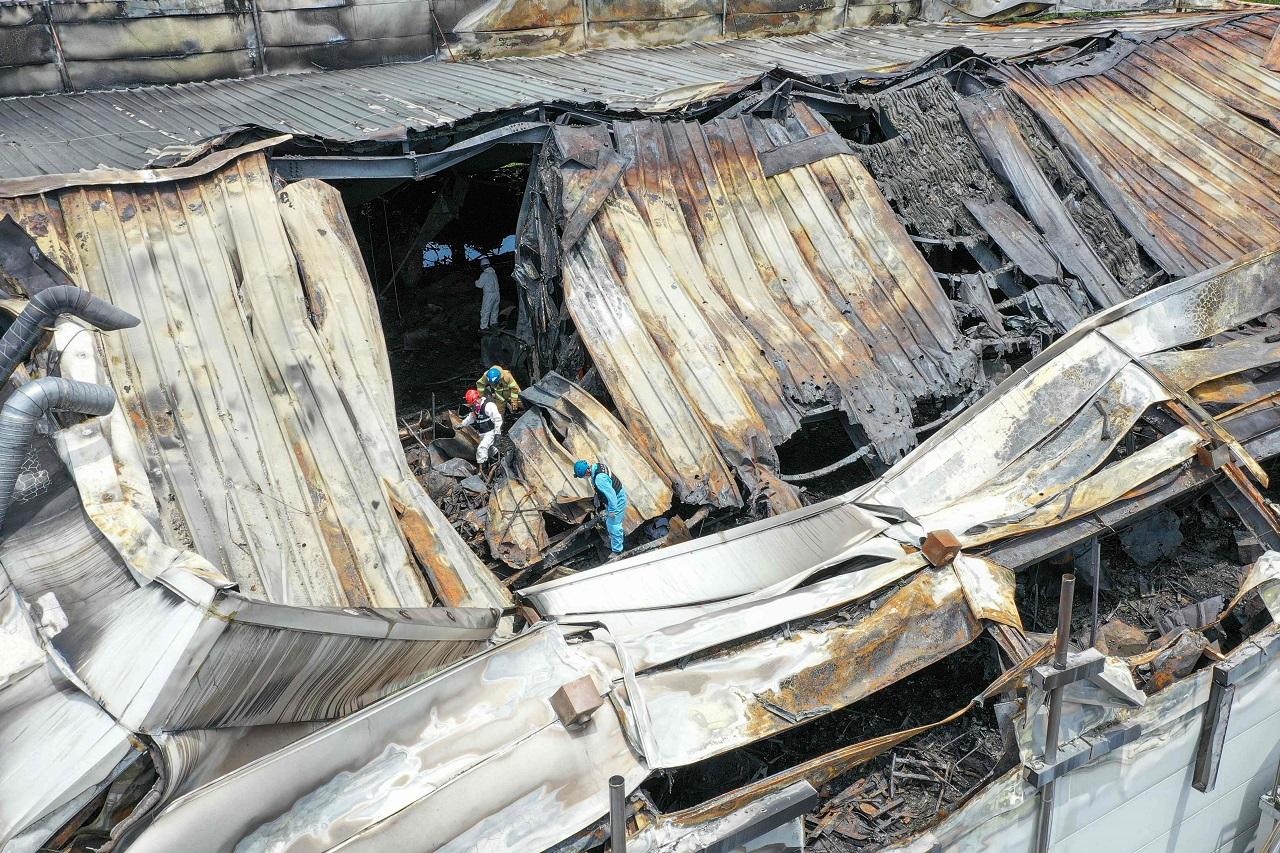 On Tuesday, more than 50 fire officers, aided by two rescue dogs and other equipment, were mobilized to continue searching the burned factory, local fire official Kim Jin-young told a televised briefing. He said partial remains had been discovered but it wasn't immediately known if they belonged to the missing person