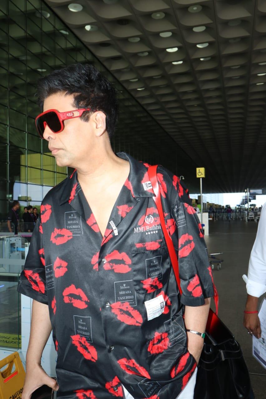 Karan Johar looked dashing in stylish black shirt with funky red prints