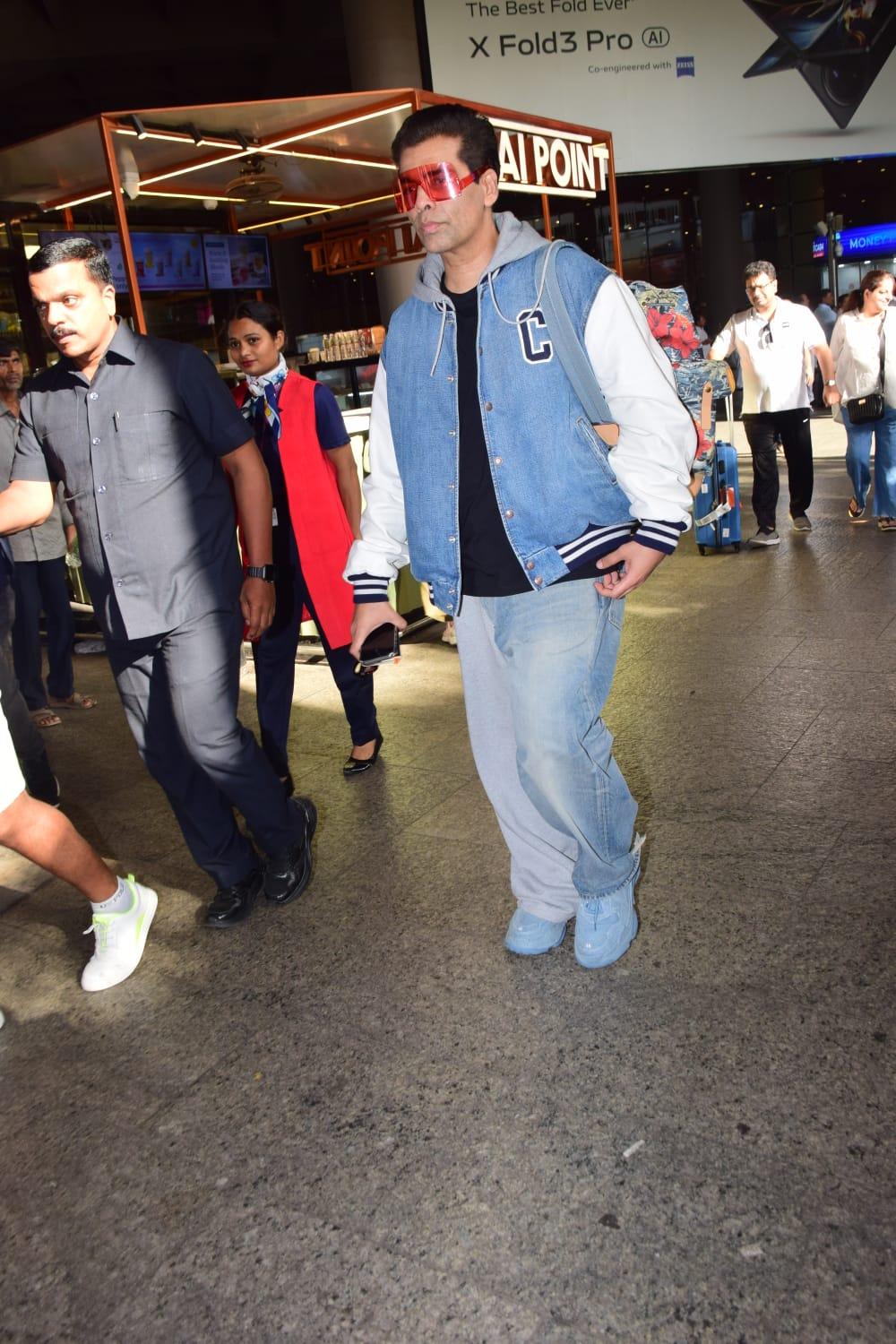 Karan Johar was clicked at Mumbai airport as he returned to Bay