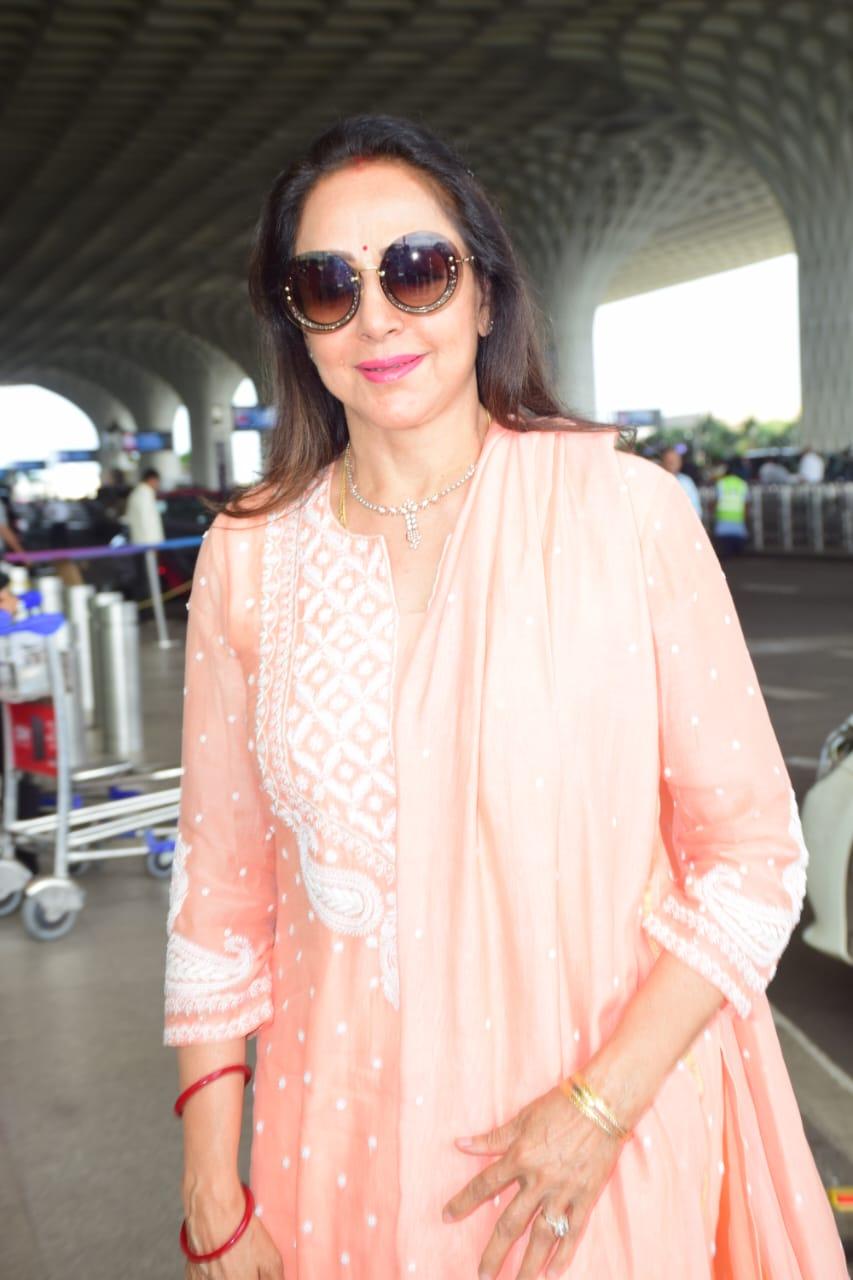 Hema Malini was clicked in a beautiful orange suit as she was clicked at airport