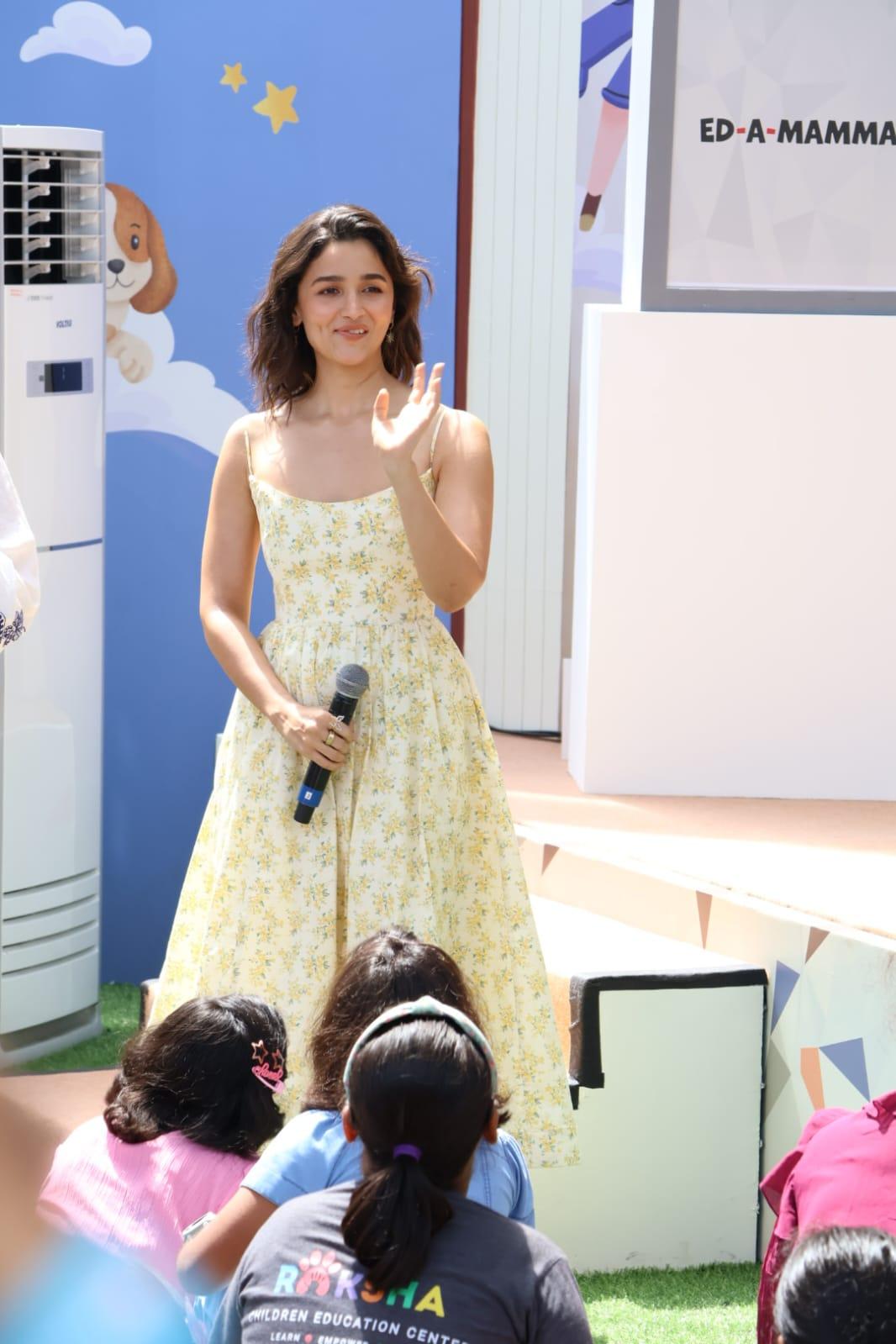 The actress wore a floral yellow dress for her outfit of the day