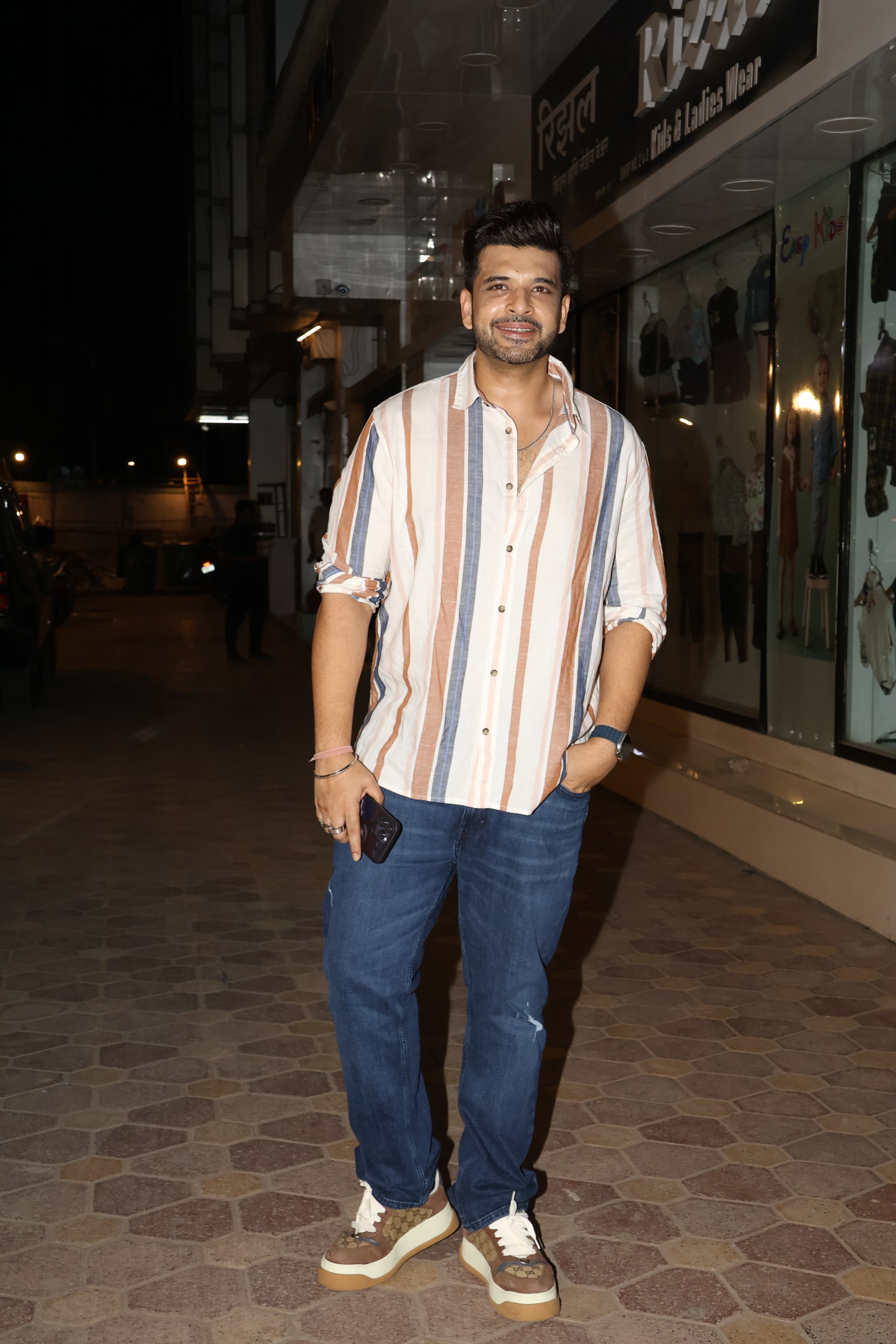 Karan Johar wore a cool and loose shirt and paired it with stylish pants as he went out
