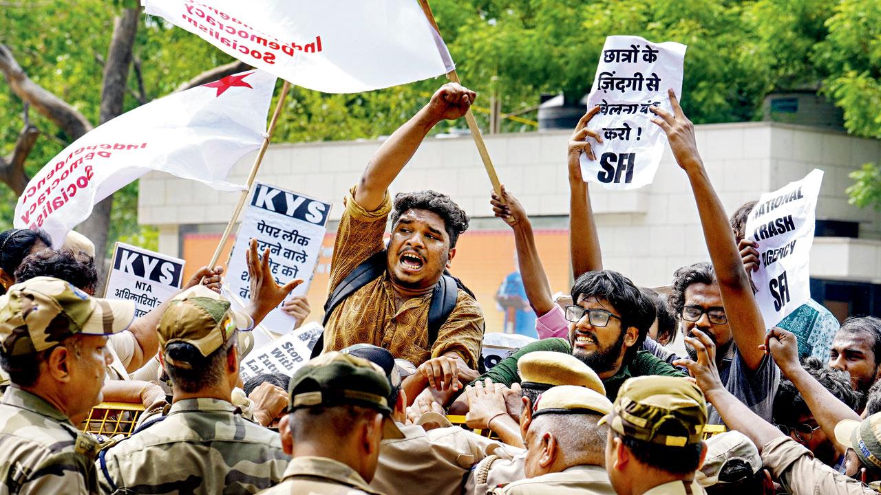 Students stage a protest over paper leak. File pic/PTI