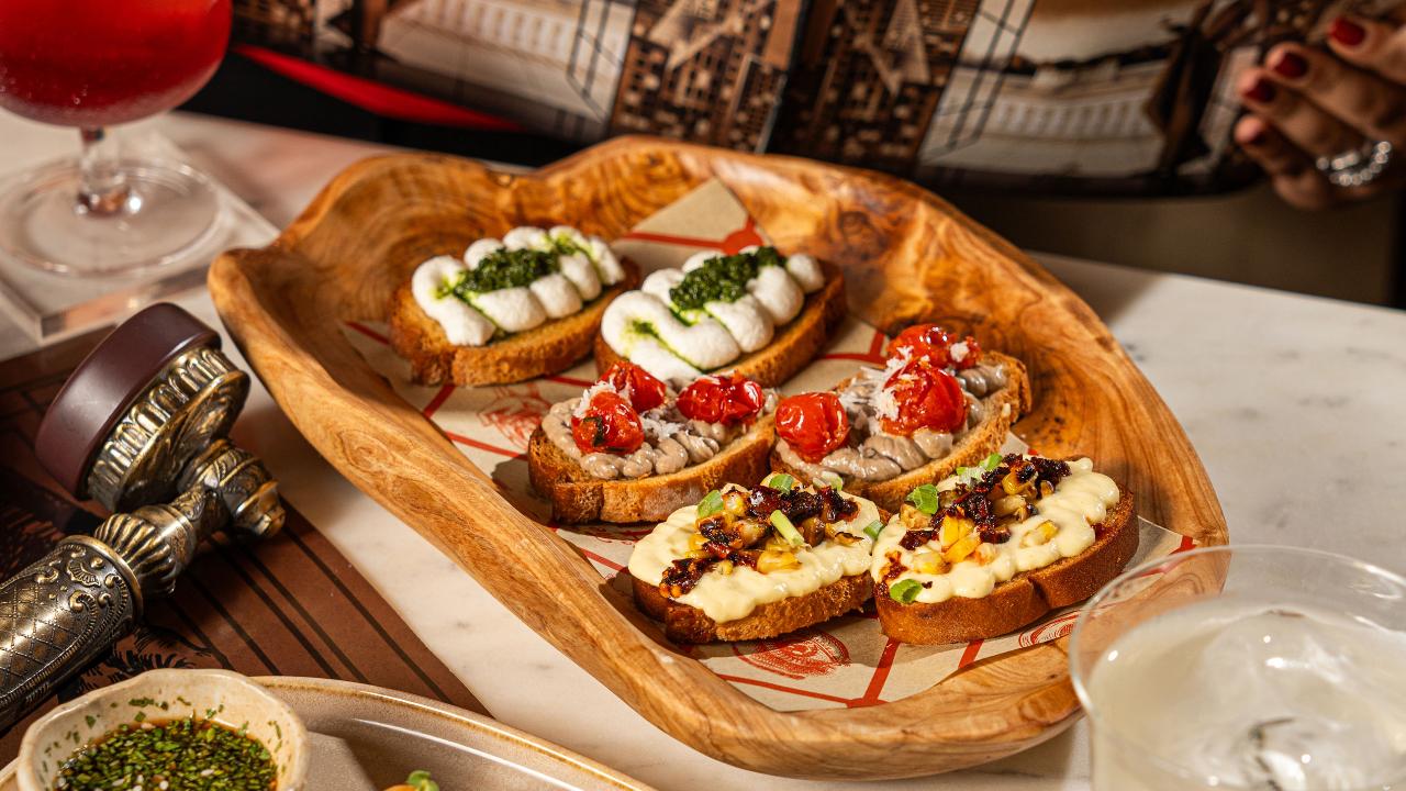Starting off the eveningIf you want to keep it light, the new bar serves Dill Pickle Pop Corn, the Spiced Nuts, and Chicken Olive Pops. For shared plates, diners can opt for the Mexican Snack Platter, the Chip & Dip Platter, or the Crostini Platter.