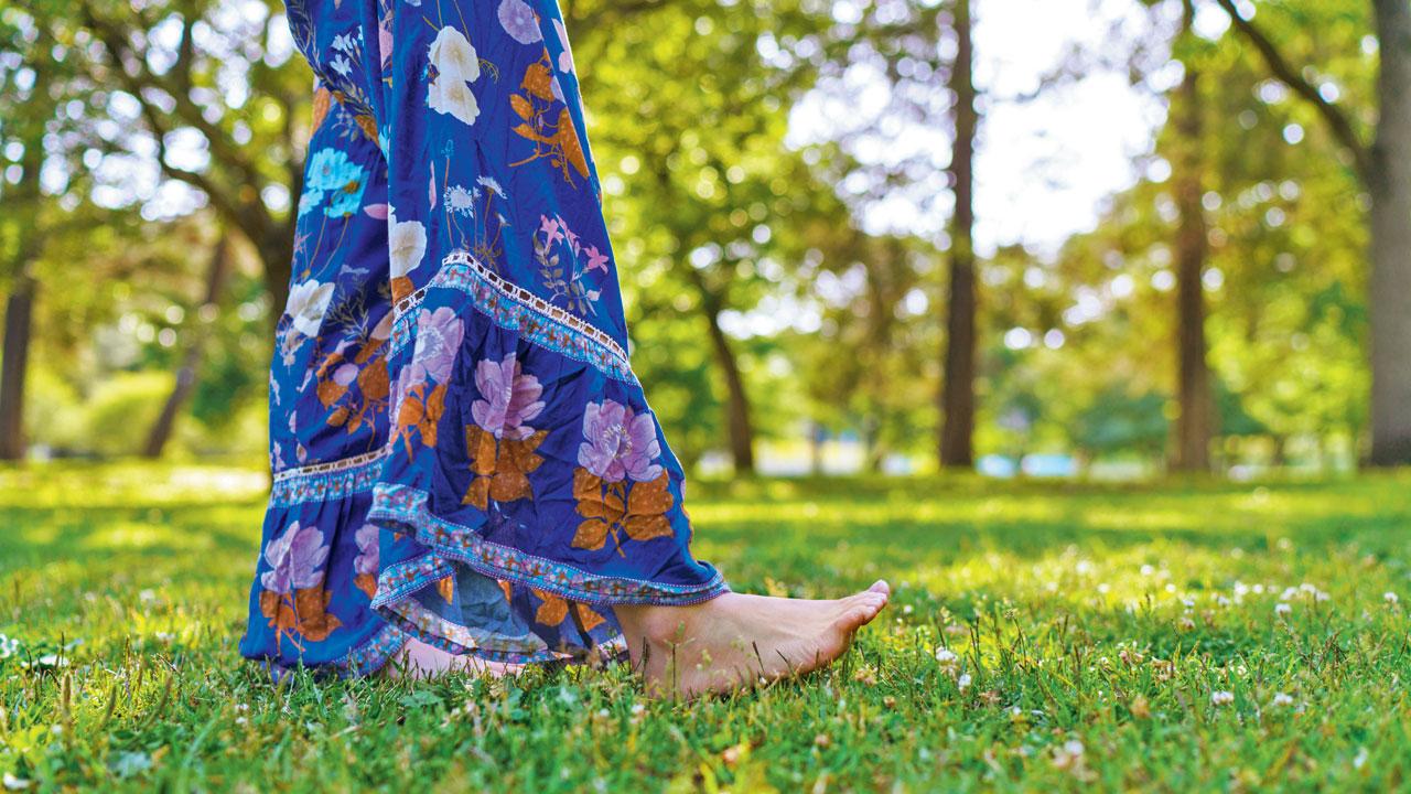 Walking barefoot on grass is an essential activity for mindfulness 