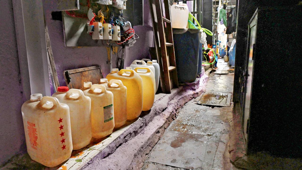 Water containers outside homes on Tuesday at Juhu Koliwada, which has been facing inadequate water supply for a month. Pic/Anurag Ahire