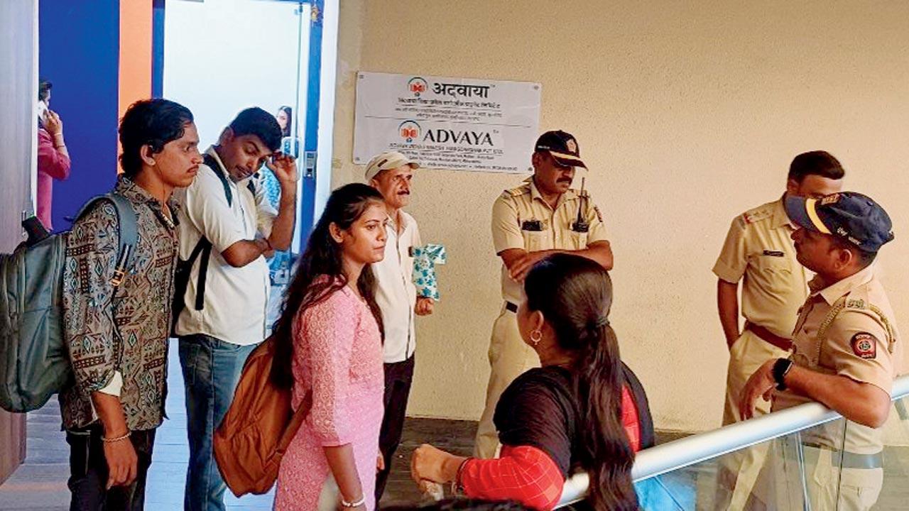 Employees and cops outside the centre in Sakinaka. Pic/Rajesh Gupta