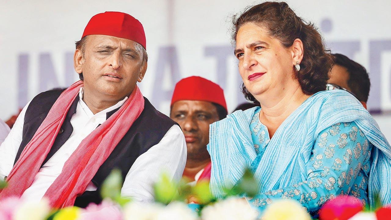 Akhilesh Yadav with Congress leader Priyanka Gandhi during a public meeting for Lok Sabha elections, in Gorakhpur in May. File pic