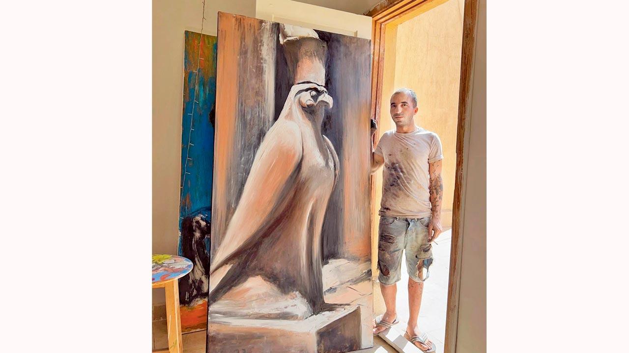 Painter and illustrator Yassin posing with his artwork. Pic/Instagram