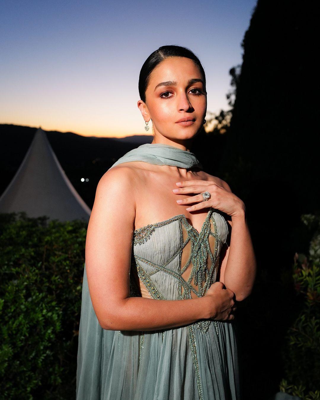 Alia Bhatt's Look 41 gown had a corset top, a flowing bohemian-style skirt, and a silk drape around her neck. 