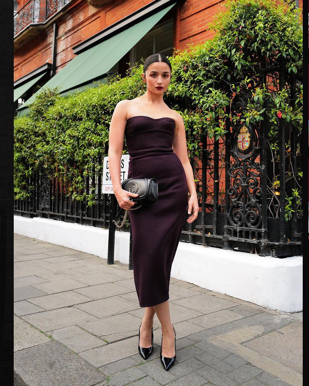 She completed the look with black slingback pumps for an elegant touch. She skipped wearing any jewelry, letting the dress and accessories shine.