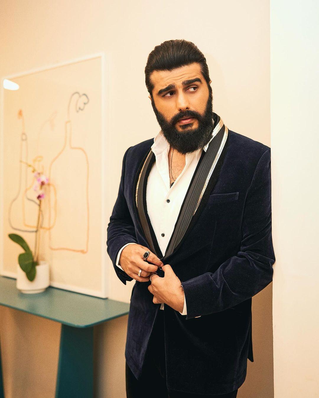 Arjun Kapoor styled his hair back in a slicked-back look.