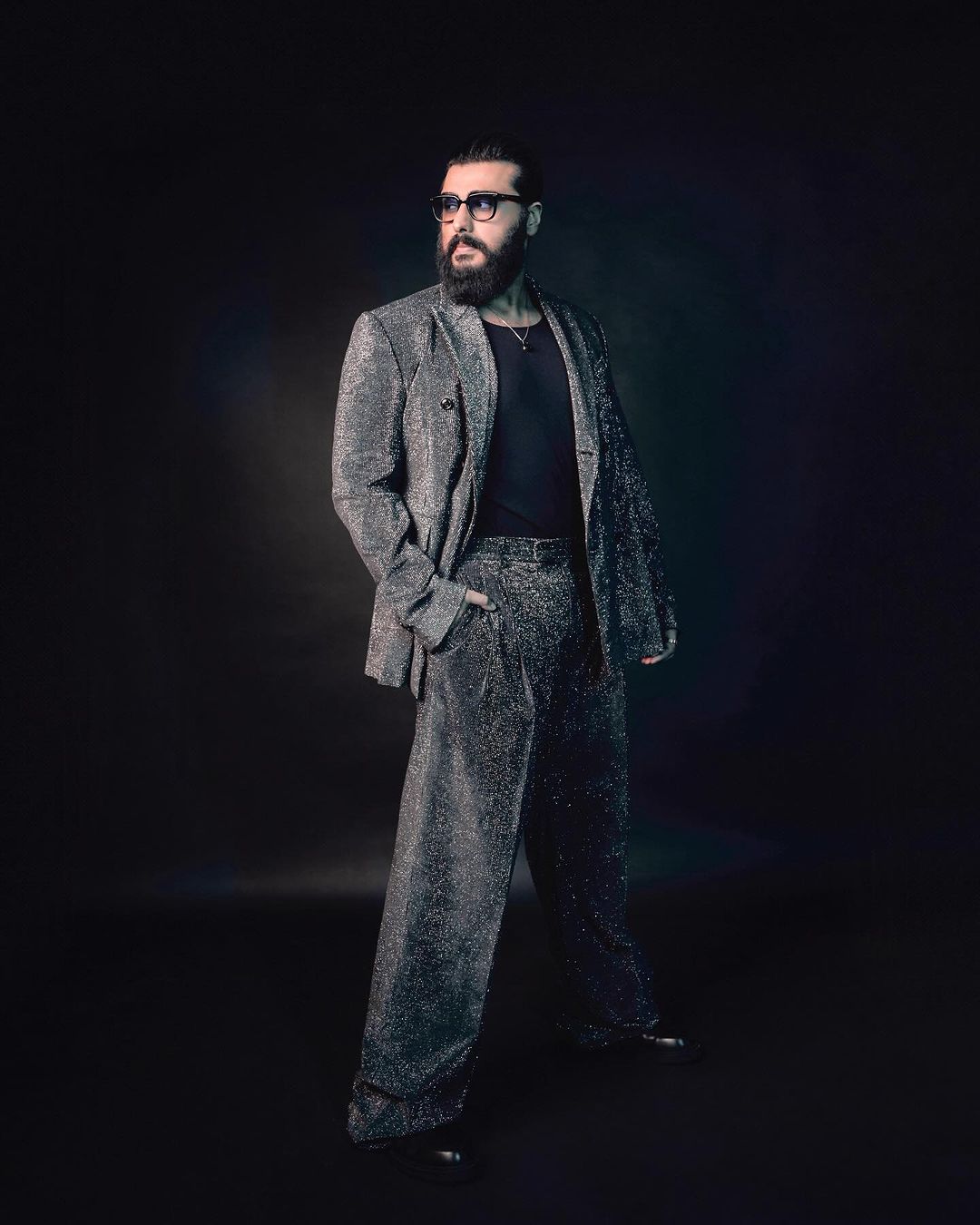 Arjun completed the entire outfit with a pair of stylish glasses, adding an extra touch of flair.