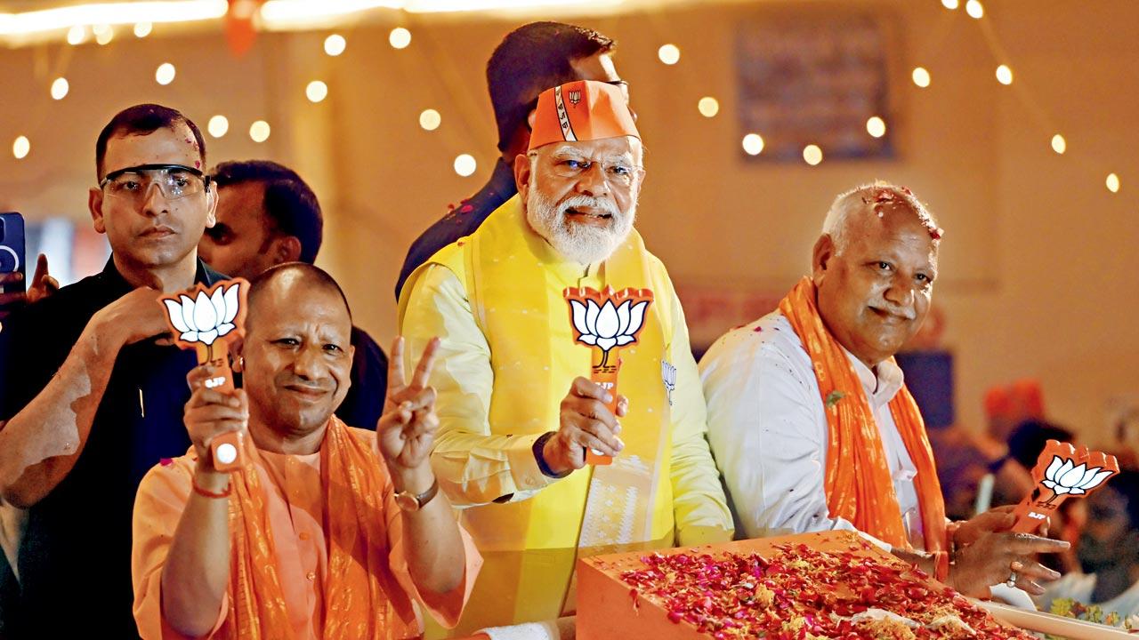 Prime Minister Narendra Modi and UP CM Yogi Adityanath campaign for BJP candidate from Faizabad (where the Ram Mandir is located)  Lallu Singh (extreme right) during a road show in Ayodhya. In a neck-to-neck fight, Samajwadi Party’s Awadesh Prasad from the Scheduled Caste Pasi community won by over 50,000 votes defeating incumbent MP Singh