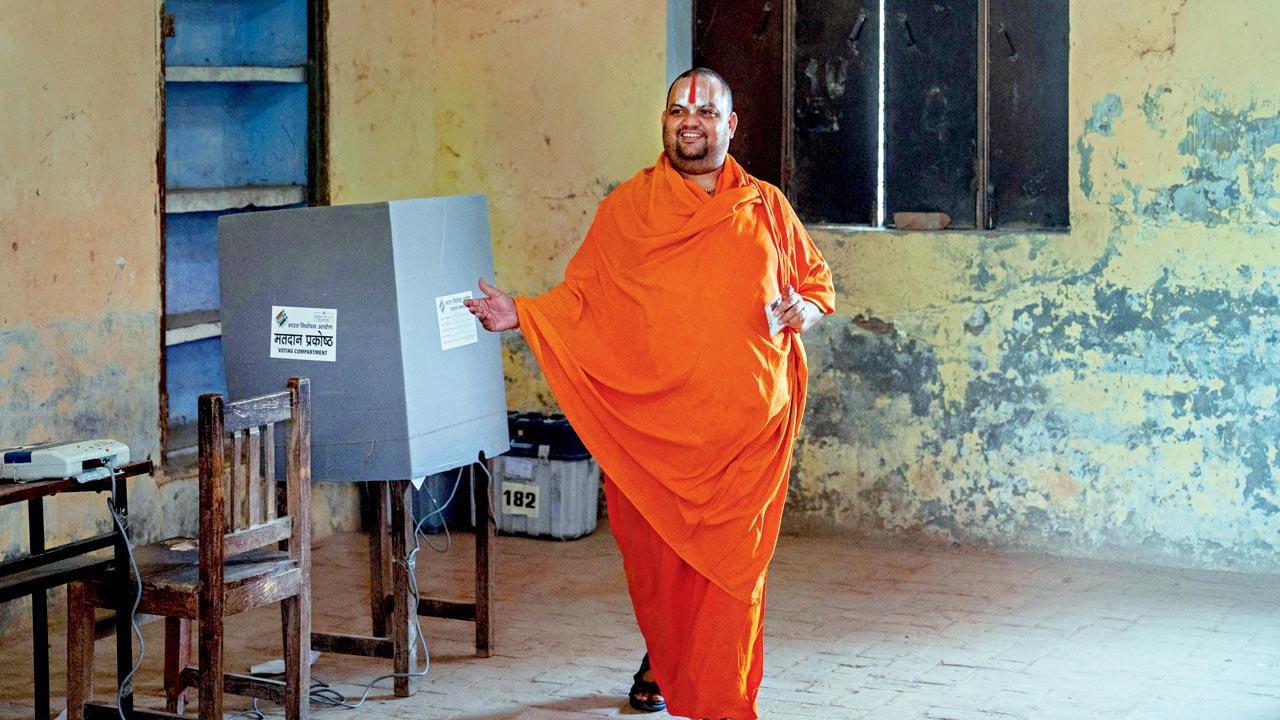 An ascetic leaves after casting his ballot at a polling station during the fifth phase of voting in Ayodhya on May 20. The defeat in four out of five assembly segments in the Faizabad constituency, where Ayodhya is situated, reiterates that the temple and development card backfired. Pics/Getty Images