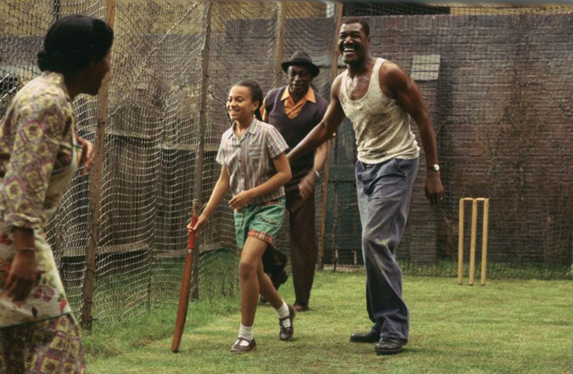 His luck changes when a West Indian family moves in next door and sets up a cricket net in their garden.