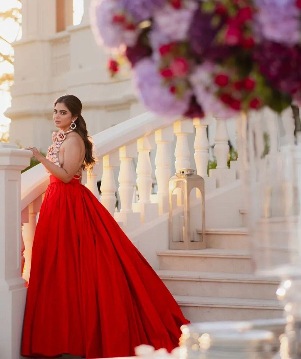 Isha Ambani, daughter of Mukesh and Nita Ambani, poses at the chateau in a stunning red gown