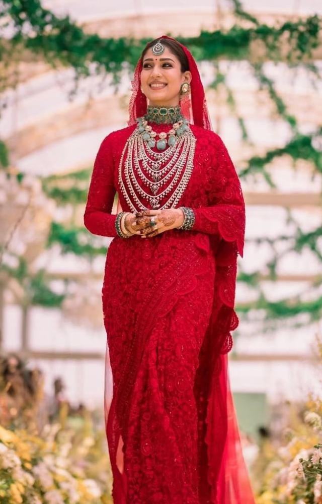 Nayanthara married Vignesh Shivan in a vermillion handcrafted saree by Monica Shah that was personalized with the couple`s names.

