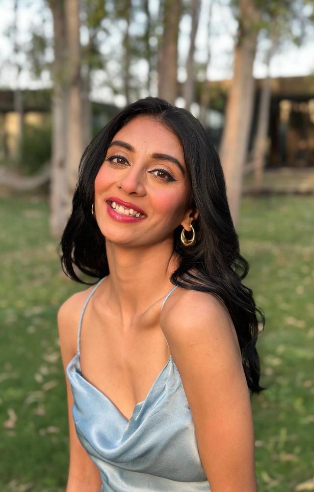 Dolly dazzles in a sky-blue strappy dress, perfect for those who prefer effortless style while keeping it minimal yet classy. 