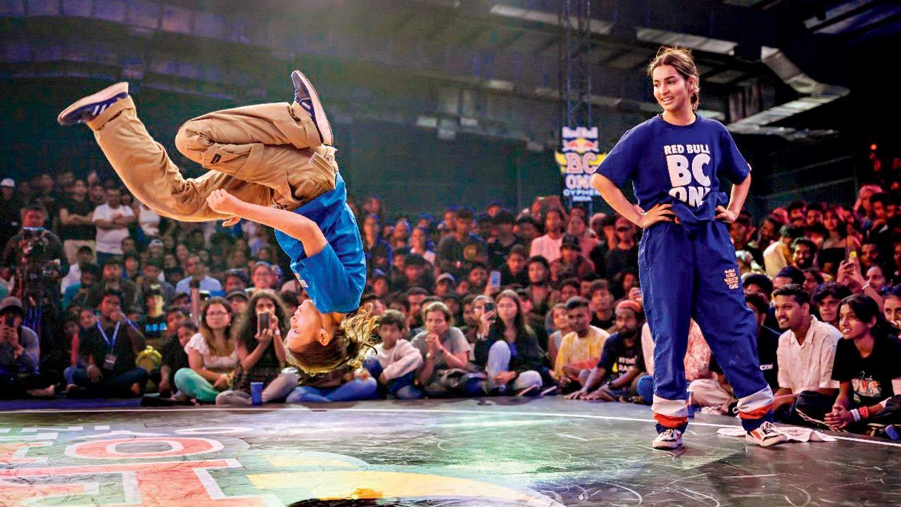 Bgirl BarB (left) performs a flip 