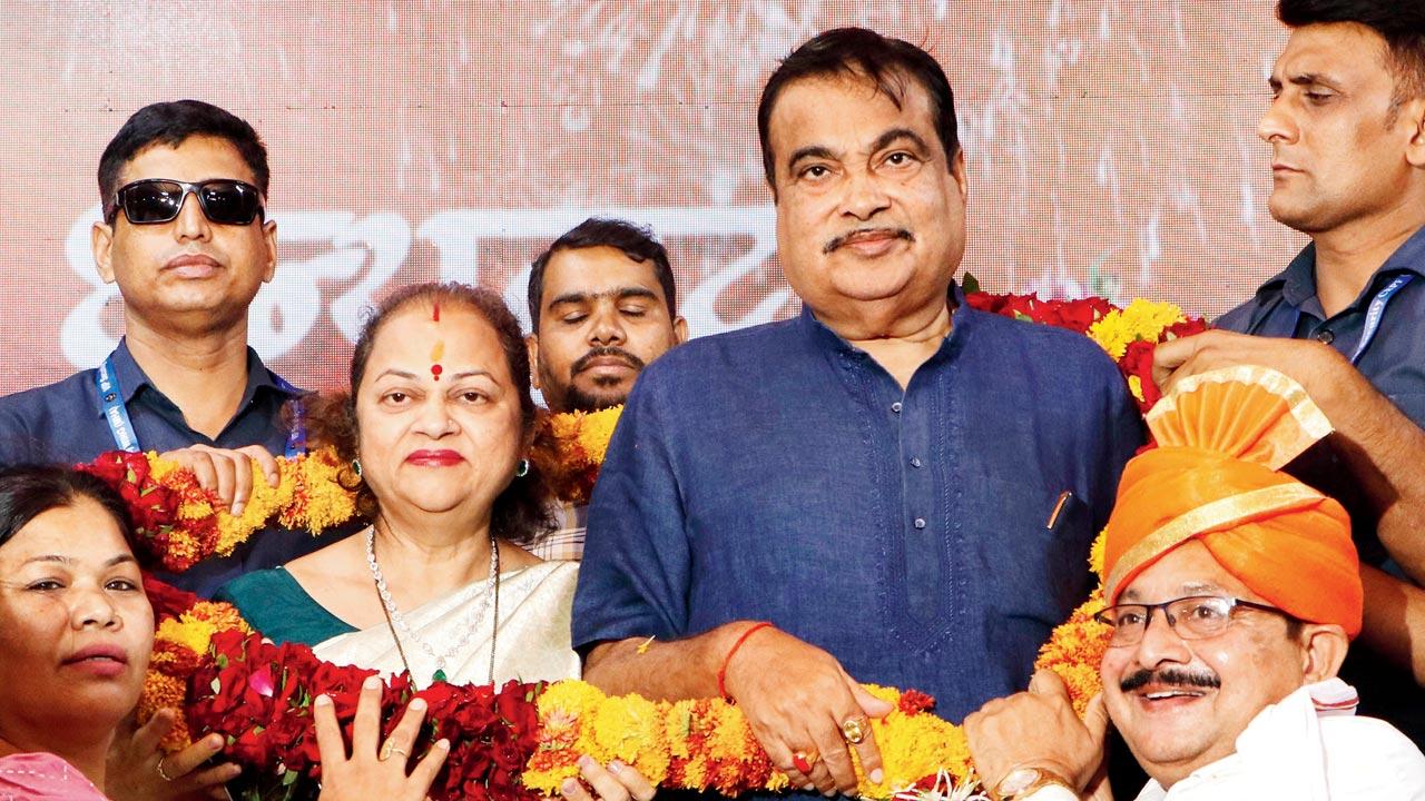 Gadkari and his wife Kanchan being garlanded by party workers. Pic/PTI