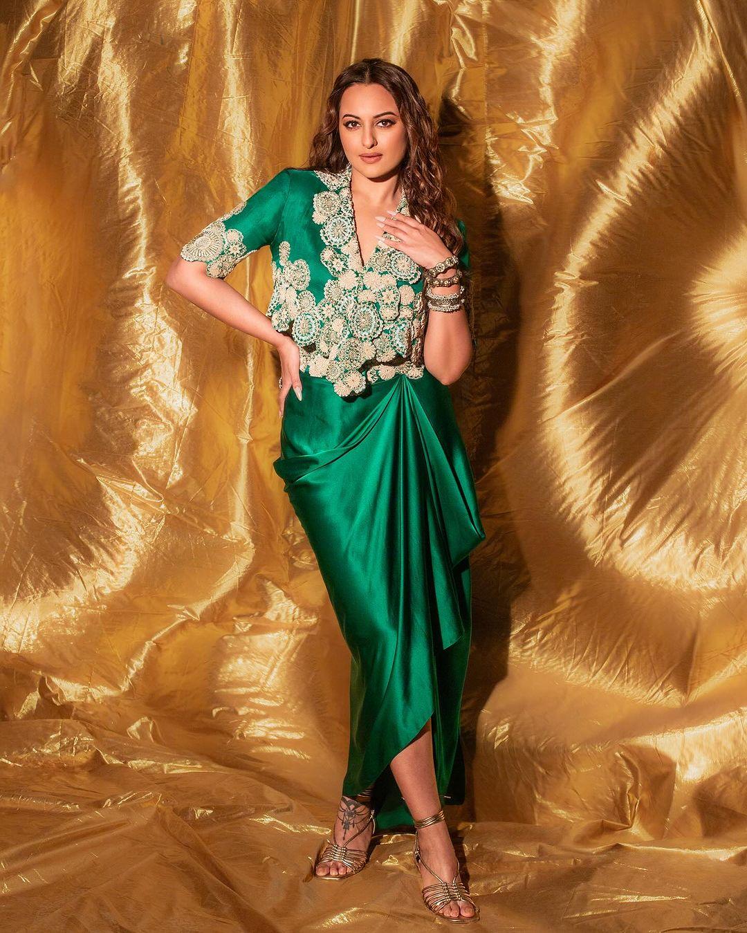This outfit is perfect for days when you don't want to wear anything heavy but wish to maintain the festive vibe. In this look, Sonakshi wore an Indo-western green dress with intricate embroidery on the top
 
