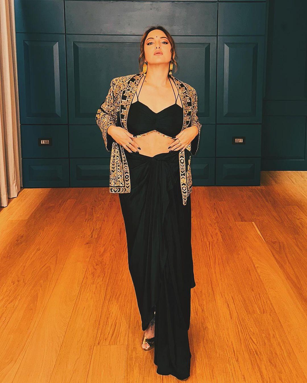 Black for the win! Sonakshi Sinha looks like a diva in this black Indo-western dress paired with a jacket