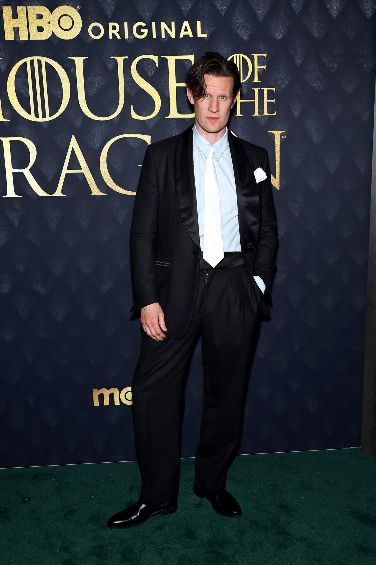 Matt Smith who essays the role of the mighty Prince Daemon Targaryen stunned in a black two-piece suit, a powder blue shirt, and a white tie. 