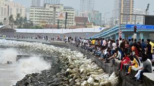 IN PHOTOS: People enjoying high tide at Marine Drive in Mumbai