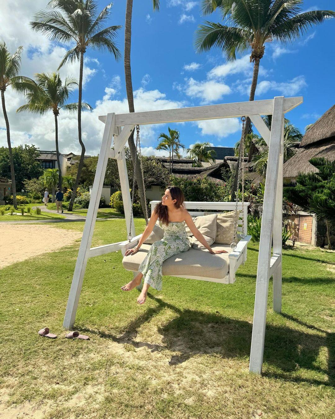 In this photo, Jasmin is seen chilling on a swing, soaking in the summer sunshine, without a care in the world.