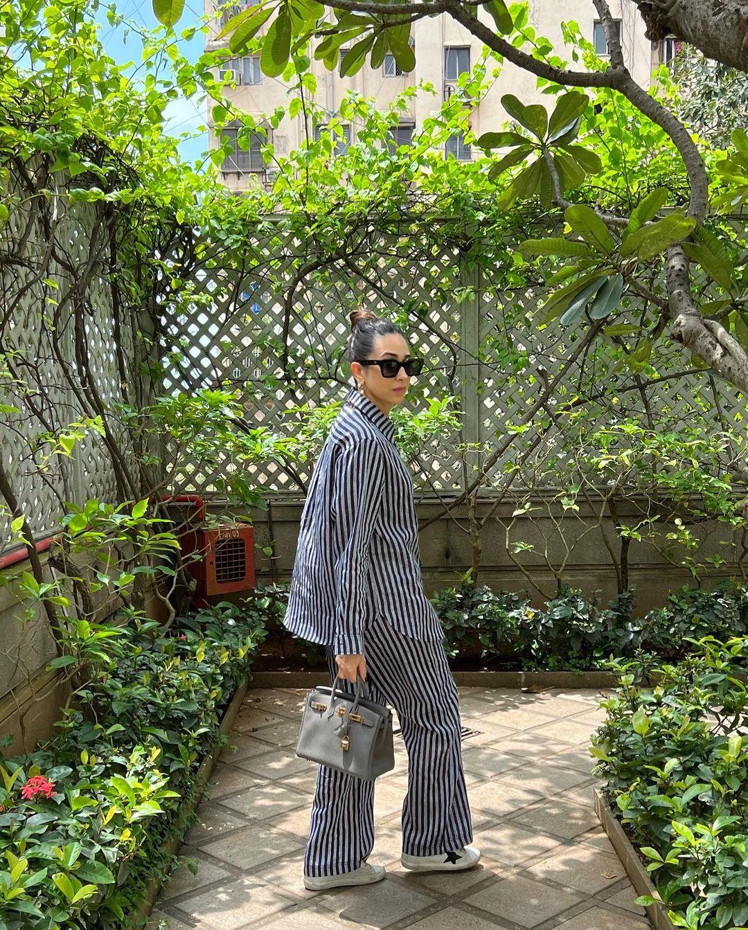 She accessorized with trendy sunglasses, golden hoop earrings, and a mini bag, looking stylish and on point.