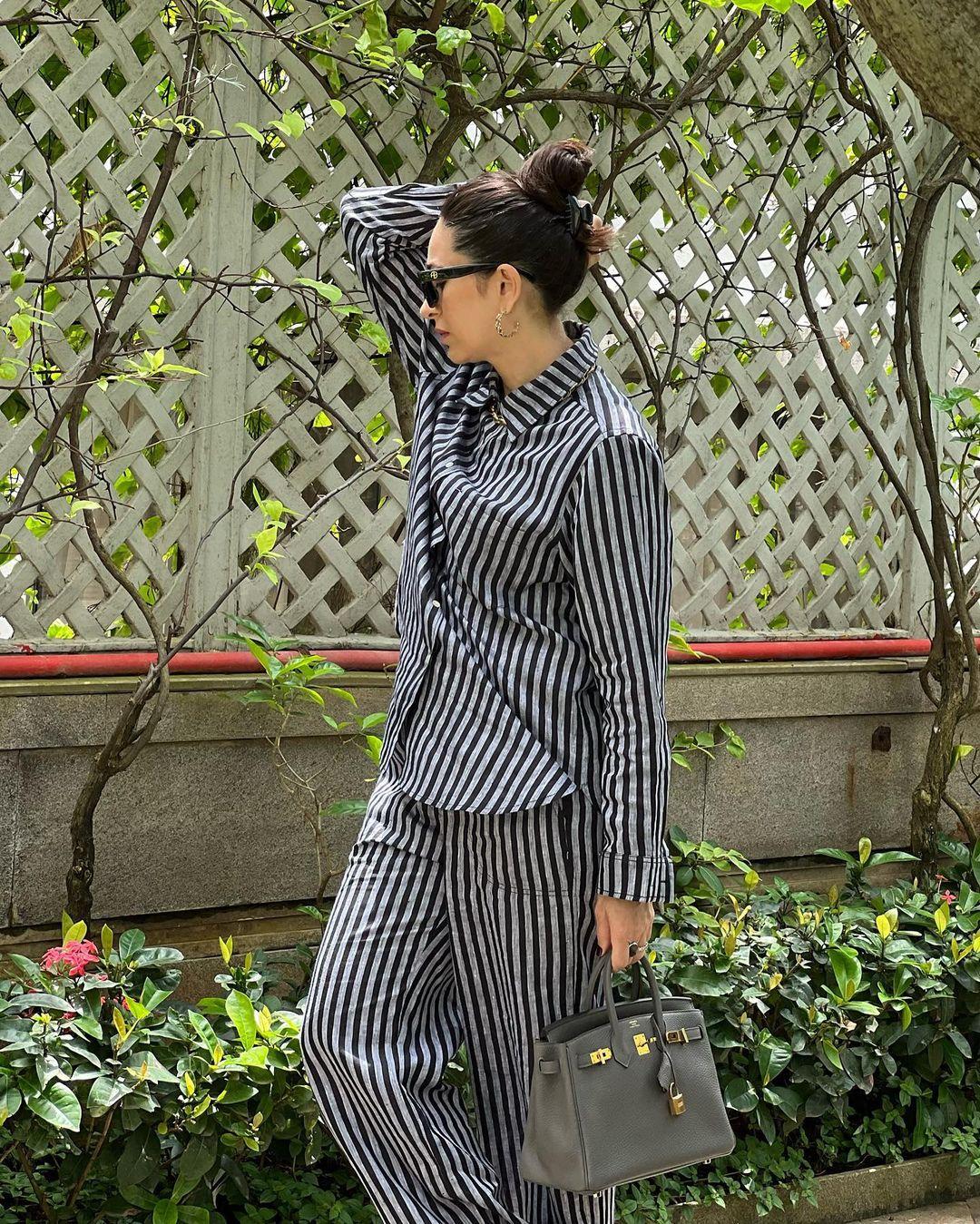 Karisma Kapoor shows how to dress effortlessly for hot weather. In a garden, she was seen wearing a pinstriped matching set. 